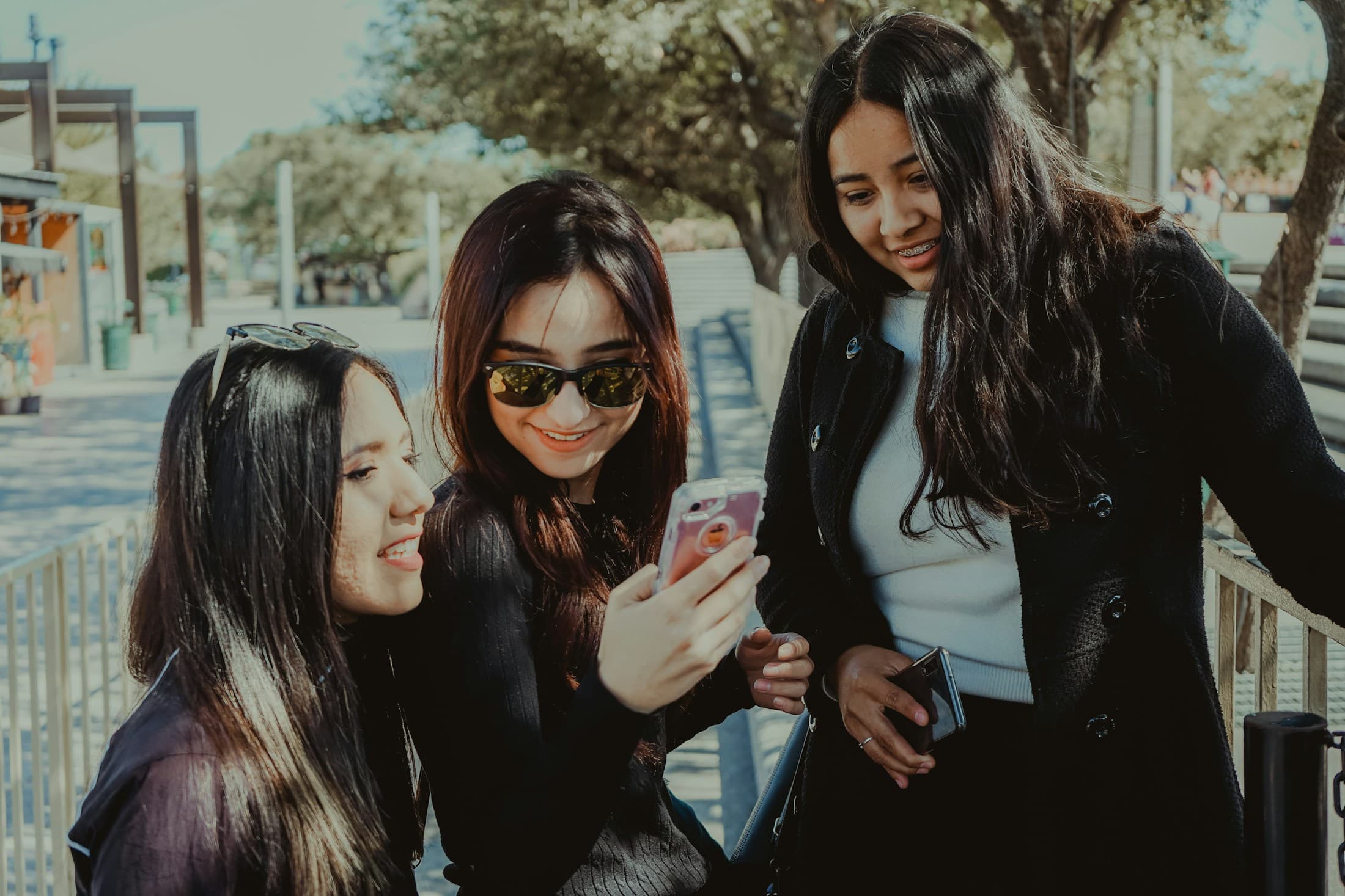 Friends sharing a moment together on a phone